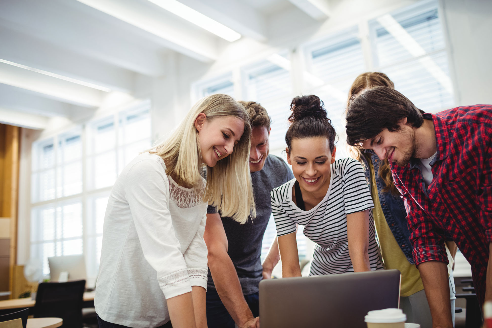 group-business-executives-using-laptop-their-desk